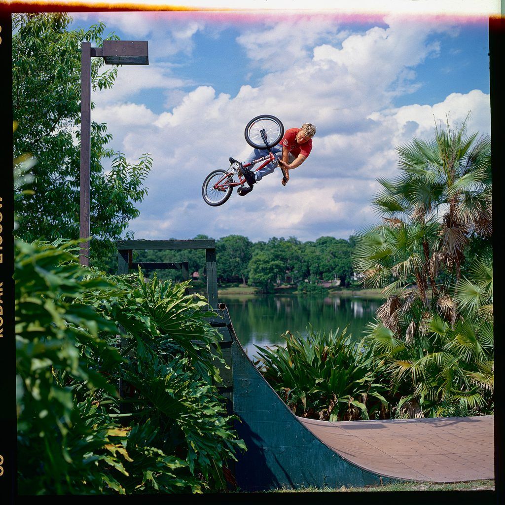 Bryce Toole, BMX Freestyler, airing out of a lake side mini-ramp.